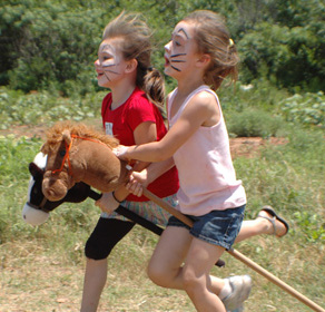 Stick horse racing at Literacy Field Day